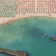 Illustration for article titled Aerial Shots of Beach Show Man Wringing Order From Nature